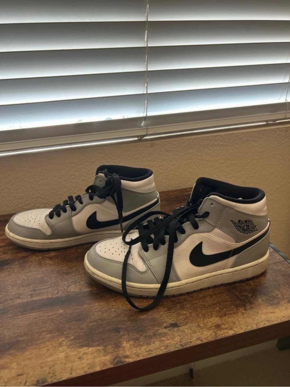 Jordan 1 mid Sneakers in White, Gray, and Black